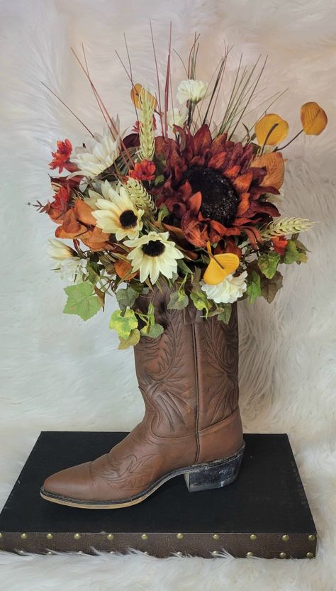 Cowboy Boot Flower Arrangement SandyMade Cowboy Boot Centerpieces, Cowboy Centerpieces, Boot Wreath, Boot Centerpiece, Country Western Decor, Country Western Wedding, Fall Mantle Decor, Fall Mantle, Cowboy Decorations