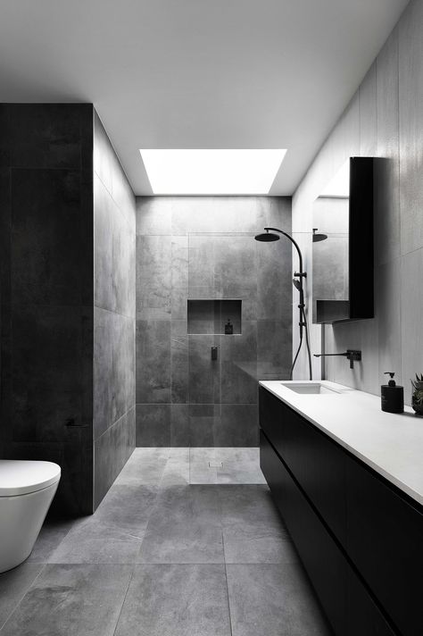 Dark moody bathroom interior design scheme by C. Kairouz Architects for a pair of modern townhouses in Thornbury, Melbourne Gray Bathroom Tile Ideas, Gray Bathroom Tile, Subway Tile Shower Niche, Black Tile Bathroom Floor, Shower Floor Tile Ideas, Tile Shower Niche, Gray Tiles, Black White Bathroom, Black Tile Bathrooms