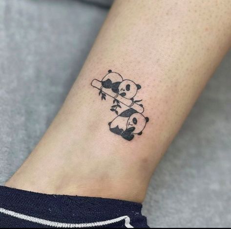 This tattoo illustrates a charming panda tattoo in chubby ink with a black coating, often called a panda bearing. They are the cutest animals. They generally dwell in jungles and eat bamboo, as shown in this tattoo of a panda... Panda Bamboo Tattoo, The Cutest Animals, Panda Family, Bamboo Tattoo, Panda Tattoo, Ankle Tattoos, Cutest Animals, Family Tattoos, Ankle Tattoo