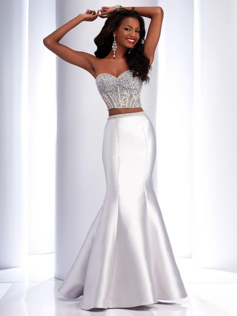 This Clarisse two-piece Pageant Dress has a beaded, strapless top and a sweetheart neckline, with a mermaid style, satin long skirt. Shown here in white. Prom 2k17, 2 Piece Prom Dress, Prom 2016, Evening Dress Long, Panel Skirt, Prom Inspo, Prom Dresses 2016, Vietnamese Dress, Formal Dress Shops