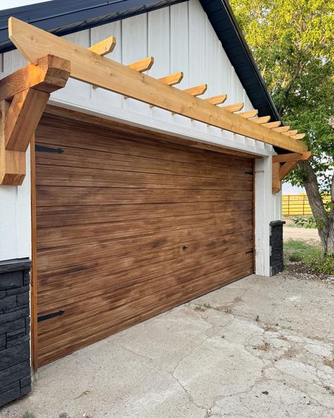 🤌🏻✨ DIY faux wood garage door and I love 😍 painted the garage knob black and added magnetic hinges to finish it off. Next up is new concrete! . . . #garage #exterior #exteriordesign #diy #project #painting #paint #home #homemakeover #garagedoors Painting Garage Doors, Faux Wood Garage Door Diy, Painted Garage Door, Garage Pergola Diy, The Sassy Barn, Driveway Paint, Brown Garage Door, Faux Wood Garage Door, Door Pergola