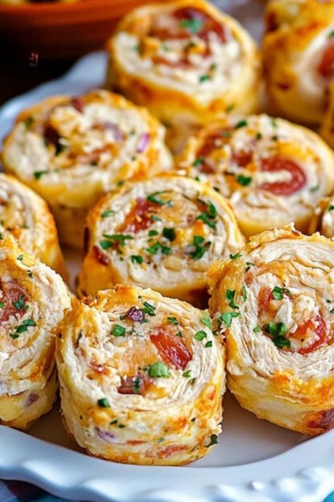 These Easy Crack Chicken Pinwheels are a crowd favorite, bursting with creamy cheese, ranch seasoning, crispy bacon, and tender chicken. Whether for a party, picnic, or quick snack, these bite-sized pinwheels deliver bold flavor in every bite. Serve them up for an effortless and irresistible treat! #Hashtags #CrackChickenPinwheels #ChickenPinwheels #EasyAppetizers #PartyFood #BiteSizedSnacks #RanchChicken #BaconLovers #PinwheelRecipe #QuickAndEasy Chicken Parmesan Pinwheels, Can Chicken Appetizers, Canned Chicken Appetizers, Easy Chicken Appetizers Simple, The Best Pinwheel Recipes, Cheddar And Bacon Pinwheels, Pinwheel Appetizers Chicken, Chicken Tortilla Pinwheels, Chicken Bacon Ranch Pinwheels Roll Ups