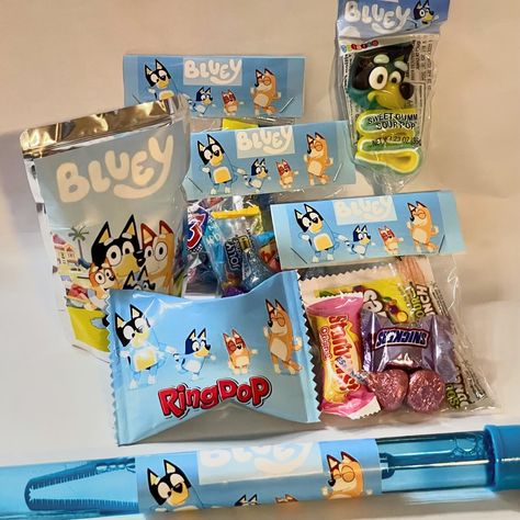 Individual birthday bundle with Bluey theme 🩵 : wrapped ring pop 💍, candy goodie bags with toppers 🍬, Bluey capri sun, Bluey bubbles 🫧, and Bluey gummy pop 🍭. Order for an individual or for a whole party or class🎈 Can be personalized with pictures and any theme! . . . #bluey #blueytheme #blueybirthday #birthdayparty #birthdaygift #easygift #easygiftideas #custompartyfavors #customgifts #endeavorgraphicdesign Personalized Candy Bags, Candy Goodie Bags, Fiesta Bluey, Bluey Party, Capri Sun, Ring Pop, Custom Party Favors, Second Birthday, Candy Bags