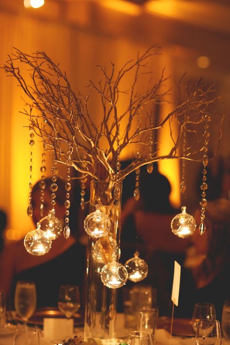 Hanging Tea Light and Gold Branch Centerpieces Lighted Branches Wedding, Lighted Branches Centerpieces, Gold Tree Branch Centerpiece, Diy Branch Centerpieces, Masquerade Ball Decorations, Gold Tree Branches, Tree Branch Centerpieces, Branch Centerpieces Wedding, Tea Lights Centerpieces