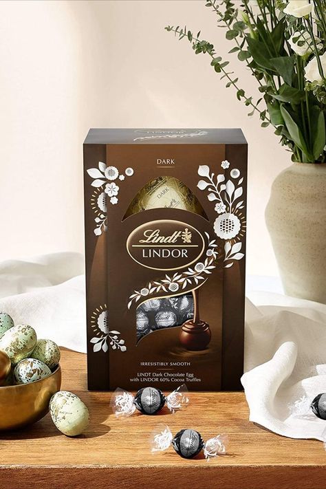 Lindt LINDOR Easter Egg Gift - Finest Lindt chocolate egg accompanied by smooth melting LINDOR chocolate truffles Give the gift of bliss with a delicious Dark chocolate egg, accompanied by smooth melting LINDOR Dark chocolate truffles Made with the finest ingredients, sourced from world-renowned growing regions A delicious and indulgent gift for Easter Since 1845, the Lindt Master Chocolatiers have been dedicated to creating the perfect chocolate delights to bring joy into your home at Easter Lindt Dark Chocolate, Lindor Truffles, Lindor Chocolate, Easter Egg Gifts, Dark Chocolate Truffles, Chocolate Egg, Lindt Lindor, Lindt Chocolate, Chocolate Delight