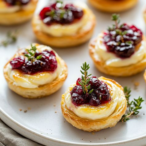 Easy Cranberry Brie Bites - Krystel's Cooking Three Ingredient Cranberry Brie Bites, Brie Bites Phyllo Cups, Cranberry Brie Bites With Orange Marmalade, Cranberry Phyllo Brie, Easy Cranberry Brie Bites, Thanksgiving Cranberry Brie Bites, Cranberry Brie Phyllo Cups, 3 Ingredient Cranberry Brie Bites, Brie Appetizer Thanksgiving