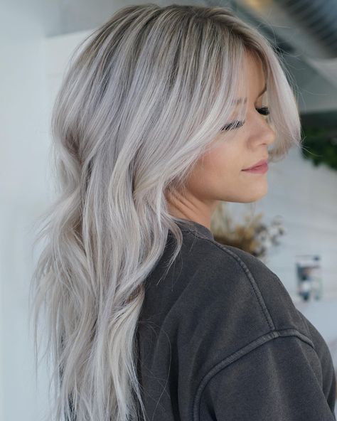 Ash blonde hair is all about that cool, smoky vibe that brings a touch of sophistication to any look. It's a fantastic option if you're aiming to swit... Grey Toned Blonde Hair, Ash Blonde Long Bob, Gray Blonde Balayage, Ashy Blonde Hair Color, Ashy Blonde With Dimension, Ice Ash Blonde Hair, Grey Ash Hair, Grey To Blonde Hair, Ash Blonde Shadow Root