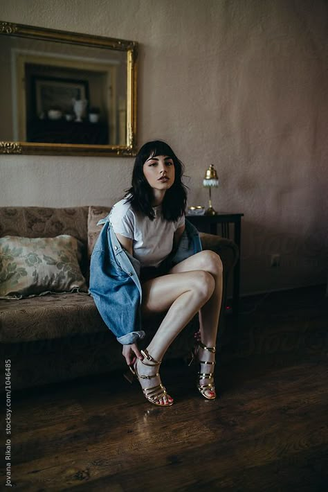 Fashionable woman sitting on sofa Seated Woman Photography, Seated Woman Reference, Sofa Sitting Pose, Sofa Poses Photo Ideas, Sofa Poses Photography, Women Sitting Poses, Sofa Photoshoot Ideas, Poses On Sofa, Woman Sitting Pose Reference