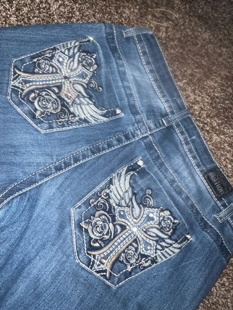 #y2k #angel #crosses #jeans #cybery2k Y2k Jeans With Gems, Flare Jeans With Pocket Design, Jeans With Bedazzled Pockets, Angel Jeans Y2k, Bejeweled Jeans Y2k, Cross Jeans Y2k, Y2k Jeans Back Pocket, Y2k Jeans Aesthetic, Rhinestone Pocket Jeans