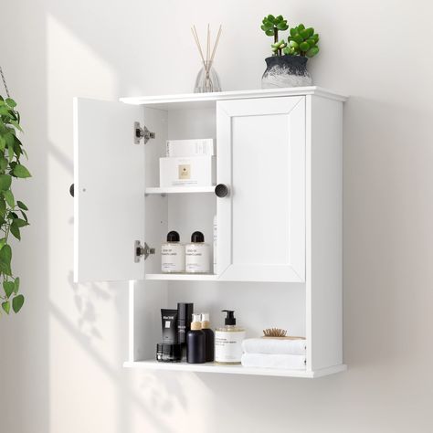 PRICES MAY VARY. Large Storage Space: This OONNEE 24" W x 30"H x 9" D bathroom wall cabinet has a large open storage space at the bottom for easy access or display and large storage space with an adjustable shelf behind 2 doors. The shelf can be adjusted to 3 different heights for customizable storage space. A great over toilet space saver storage cabinet Elegant Wall Cabinet with Classic Metal Handle: Classic metal door handles add elegance to this white bathroom wall cabinet. The wall mounted Above The Toilet Storage, Storage Cabinet Wall, Over Toilet Storage Cabinet, Toilet Storage Cabinet, Over Toilet Storage, Wood Medicine Cabinets, Bathroom Wall Cabinet, Wall Mounted Bathroom Cabinets, Wooden Storage Cabinet