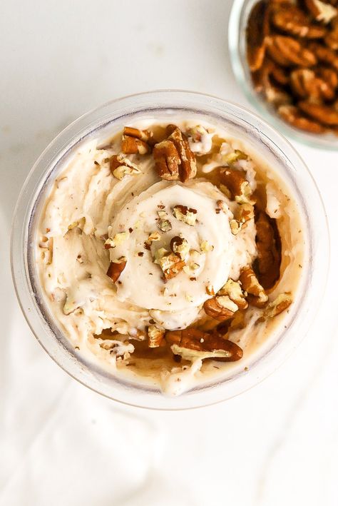 Top down view of butter pecan protein ice cream with chunks of nuts in the ninja creami pint container. Creami Fairlife Protein Recipes, Nutri Creami Recipes, Butter Pecan Ninja Creami Recipe, Ninja Creami Butter Pecan Recipe, Cookie Butter Ice Cream Ninja Creami, Butter Pecan Ice Cream Ninja Creami, Ninja Creami Fairlife Protein Ice Cream, Butter Pecan Ninja Creami, Protein Ninja Creami Recipe