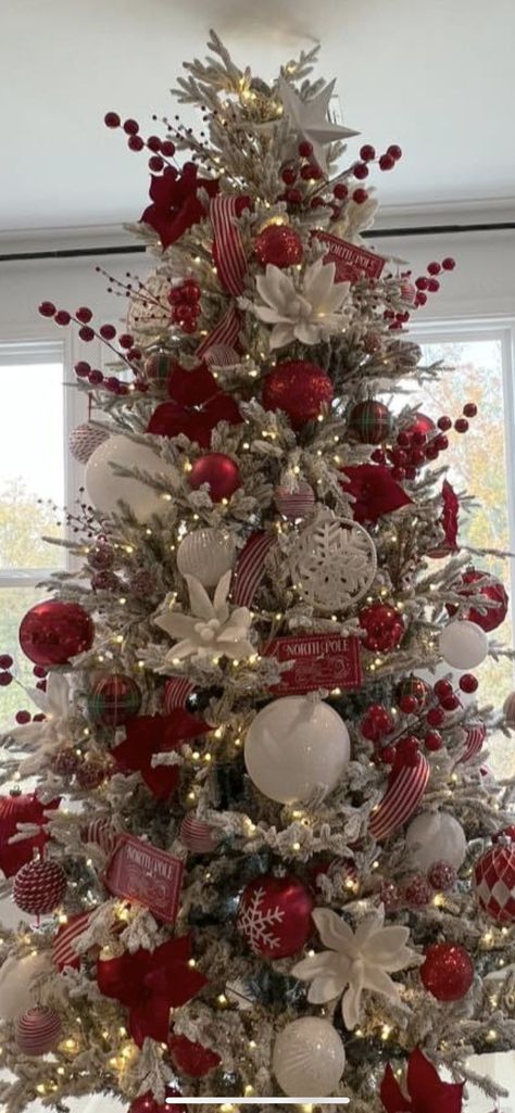 Santa Clause Themed Tree, Red Glam Christmas Tree, Christmas Tree Ideas Flowers, Red Decor Christmas Tree, Snowflake Christmas Tree Theme, Christmas Tree With Poinsettia Flowers, Red Christmas Trees, Red And Champagne Christmas Tree, Cardinal Christmas Tree Ideas