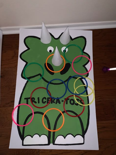 Dinasour Birthday Activities, Dinosaur Ring Toss, Diy Pin The Tail On The Dinosaur, Diy Dinosaur Party Games, Triceratops Game, Pin The Tail On The Dinosaur, Dinosaur Games For Kids Party Ideas, Dinosaur Gross Motor Activities, Vbs Dinosaur Theme