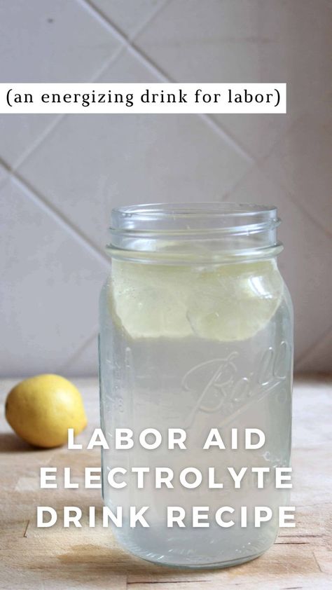 A glass mason jar filled with labor aid electrolyte drink and lemon slices with a stainless steel straw. A lemon is in the background. The text says labor aid electrolyte drink recipe an energizing drink for labor. Diy Breast Pads, Nora Tea, Fire Cider Benefits, Homemade Tea Blends, Homemade Burp Cloths, Best Electrolyte Drink, Pregnancy Self Care, Linen Spray Recipe, Electrolyte Drink Recipe