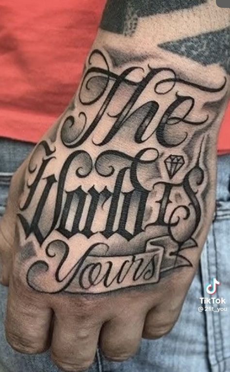 The World Is Yours Hand Tattoo, World Is Yours Tattoo, The World Is Yours Tattoo, Cholo Tattoo, Black And White Flower Tattoo, Best Tattoo Fonts, Herren Hand Tattoos, Tattoo Font For Men, Tattoo Quotes For Men