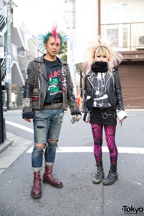 Kentaro & Asuka are two Japanese punk rockers who caught our eye in #Harajuku. Kentaro is a longtime member of the Japanese pogo punk band the erections. Their punk looks include crosshawk & mohawk hairstyles, studded leather jackets & lace up boots. #tokyofashion   #street snap Japanese Punk Fashion, Japanese Punk, Punk Jeans, Harajuku Punk, Rad Clothes, Punk Culture, Punk Rock Outfits, Punk Looks, Boy Jeans