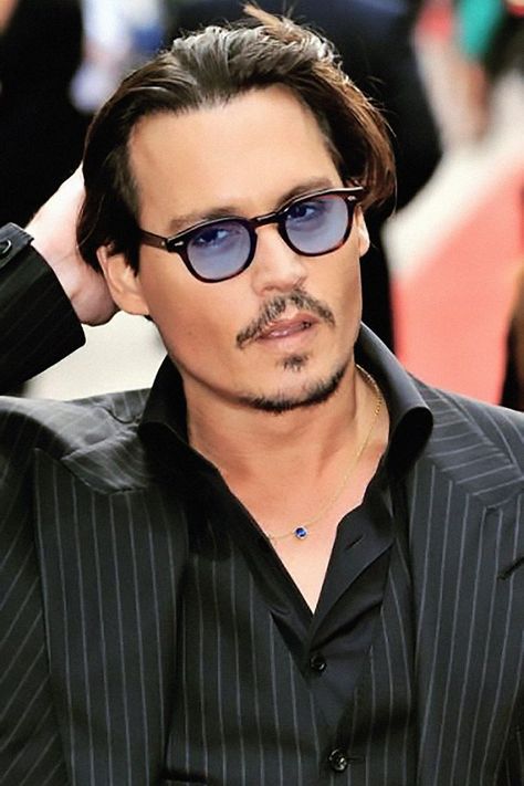 Johnny Depp wearing his signature sunglasses
with blue lenses Blue Sunglasses Men, Tinted Glasses Men, Blue Sunglasses Outfit, Blue Tinted Glasses, Blue Tinted Sunglasses, Eyewear Website, Blue Lens Sunglasses, Masculine Elegance, Glasses Outfit