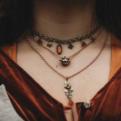 Made in a small goldsmithing workshop in southern germany - Imay have teased the tiny cauldrons enough by now, but let me show you how beautifully stackable they are!😍🍂✨ You can get this perfect autumn set of choker, cauldron necklace and oak leaf necklace on October 25th in my shop.🖤 #fantasyjewelry #paganwitch #witchy #witchesofinstagram Witch Necklace Aesthetic, Yule Jewelry, Urban Witch, Celtic Witch, Elven Fairy, 2023 Vibes, Oak Leaf Necklace, Autumn Witch, Autumn Jewelry