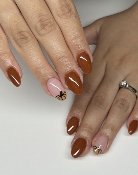 Add a twist to your manicure with perfect almond shape nails and accent nails. The accent nails with pumpkin patterns complement the rich brown base to create a cozy autumn color and a contemporary appearance. Perfect Almond Shape, Fall Almond Nails Ideas, Almond Nails Ideas, Nail Designs For Fall, Fall Almond Nails, Holiday Nail Polish, Almond Nail Designs, Pumpkin Patterns, Long Almond Nails