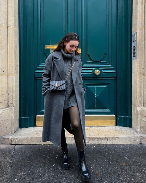 A girl wearing a big grey coat with black boots grey dress and a  saint Laurent bag Grey Winter Coat Outfit Classy, Grey Coat Outfit Winter Classy, Grey Winter Coat Outfit, Barcelona Winter Outfit, Gray Wool Coat Outfit, Amsterdam Winter Outfit, Dark Grey Coat Outfit, Light Grey Coat Outfit, Long Grey Coat Outfit