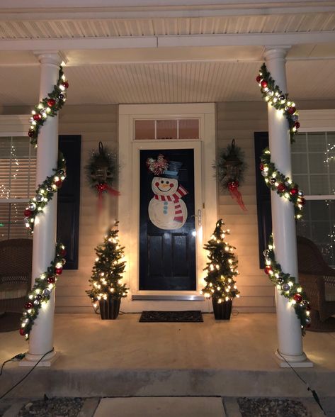 Front Porch Column Christmas Garlands with white lights & red & silver ornaments Christmas Garland Columns, Christmas Garland Front Porch Columns, Christmas Garland Outdoor Pillars, Small Front Porch Christmas Lights, Pillar Christmas Lights, Christmas Decor Porch Columns, Outside Pillar Christmas Decor, Decorating House Columns For Christmas, Outside Column Christmas Decorations