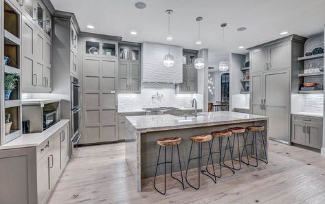 Contemporary kitchen with light gray cabinets, light wood floors and white textured backsplash Grey Wood Floors Kitchen, Light Flooring, Light Wood Flooring, Grey Kitchen Tiles, Light Grey Kitchen Cabinets, Light Wood Kitchens, Light Grey Kitchens, Hardwood Floors In Kitchen, Grey Kitchen Floor