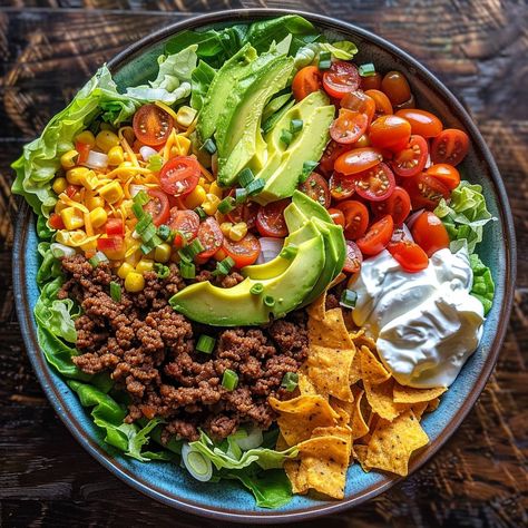 🥗 Unleash flavor with our Loaded Taco Salad! Fresh, zesty, and packed with goodies! #TacoTuesdayEveryDay 🍽️ Loaded Taco Salad 🛒 Ingredients: 500g ground beef 1 packet taco seasoning 1 head lettuce, chopped 1 cup cherry tomatoes, halved 1 avocado, diced 1/2 cup cheddar cheese, shredded 1/2 cup sour cream 1/2 cup salsa Tortilla chips, crushed 👩‍🍳 Instructions: Cook: Brown beef with taco seasoning. Layer: In a large bowl, layer lettuce, beef, tomatoes, avocado, and cheese. Serve: Top with so... Taco Salad Ingredients, Instagram Recipes, Healthy Food Dishes, Taco Salad, Taco Seasoning, Tortilla Chips, Large Bowl, Healthy Lunch, Cherry Tomatoes