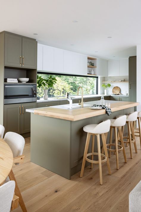 Meet elegant entertainer! This stunning two-tone, olive green kitchen beautifully balances style and functionality. With ample storage to keep everything organised, the warm green tones create a cosy atmosphere perfect for hosting.  The vibrant terrazzola benchtops paired with American oak on the island add unique personality, making it an inviting backdrop for your culinary creations and gatherings.  #kitchen #greenkitchen #olive #green #twotonekitchen #style #modern #scandi #kitcheninspo Kaboodle Benchtop, Kaboodle Kitchen, Olive Green Kitchen, Flatpack Kitchen, Country Kitchen Ideas, Country Vibes, Kitchen Design Pictures, Scandi Interiors, Kitchen Mood Board