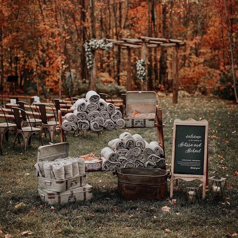 Keep your wedding guests warm at your outdoor fall or winter wedding ceremony by handing out cozy grey blankets. Complete this rustic blanket display with a wooden wedding welcome sign and a setup of matching cases! Here are other elegant ways to display blankets at your wedding. // Photo: Move Mountains Co. and Planner: Cristen & Co. Fall Wedding Fire Pit, Backyard Micro Wedding Fall, Outdoor Wedding Ideas On A Budget, Cheap Fall Wedding Ideas, Fall Wedding Ideas October, Display Blankets, Rustic Fall Wedding Colors, Oct Wedding, Mountain Wedding Ideas