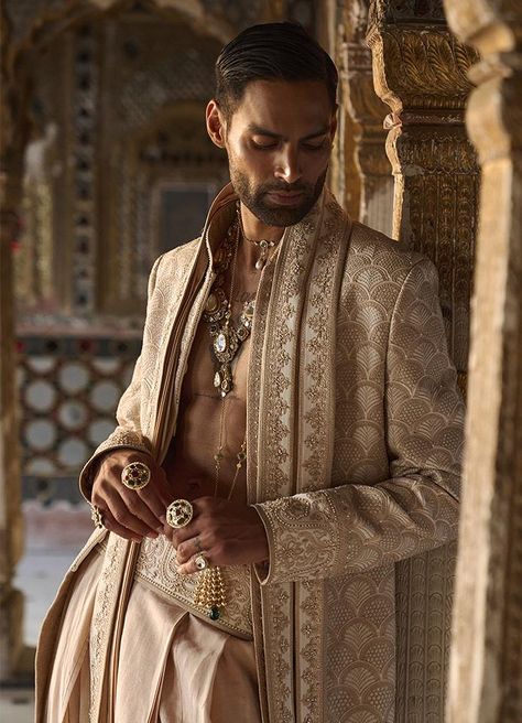 Tarun Tahiliani Menswear Collection The designer menswear collection is a metro male's dream come true. The Tarun Tahiliani groom collection can teleport anyone within seconds to a bygone era of luxurious royalty�—where silk and brocade kiss zari and applique; and dhotis and churidars regale. If that is not enough for y Tarun Tahiliani Menswear, Groom Collection, Indian Male Model, Gq Mens Style, Fashion Model Sketch, Couple Wedding Dress, Fashion Poster Design, Bts Black And White, Model Sketch