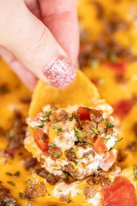 Rotel Hot Sausage Dip - always the star of our parties! You can make ahead of time and bake when ready. Seriously delicious!! Hot sausage, cream cheese, sour cream, cheddar cheese, diced tomatoes with green chiles. Serve with tortilla chips or corn chips. Everyone LOVES this yummy dip!! #dip #footballfood #gameday #partyfood #sausage #rotel Hot Sausage Dip Recipes, Sausage Rotel Cream Cheese Dip Crock Pot, Sausage Taco Dip, Jimmy Dean Sausage Dip Recipes, Rotel Appetizer Recipes, Appetizers Using Sausage, South Of The Border Dip, Sausage Cream Cheese Rotel Dip, Hot Appiterzers