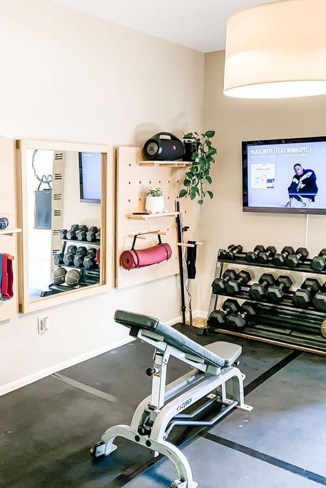 These stylish and practical spaces make it easy to fit exercise into your daily routine. Home Gym Basement, Home Gym Storage, Home Gym Ideas, Small Home Gym, Workout Room Home, Home Gym Garage, Mini Gym, Diy Home Gym, Overhead Garage