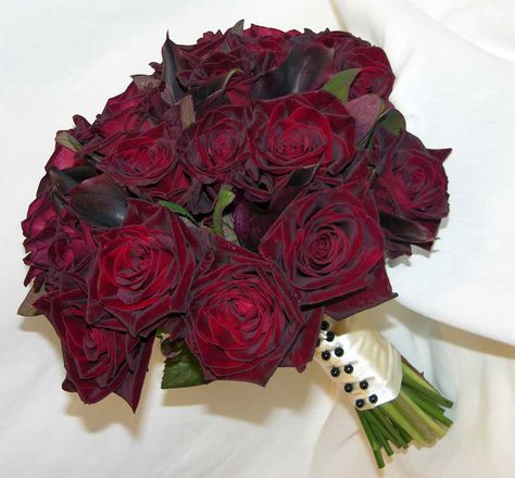 'Black Bacara' roses - accented with Cotinus foliage and 'Schwartzwalder'… Dark Romantic Bouquet, Red And Black Flowers, Red And Black Rose Bouquet, Red Roses Black Bouquet, Black Baccara Rose Bouquet, Red And Black Prom Flowers Bouquet, Black Baccara Roses, Red Rose Bouquet Wedding, Dark Red Roses