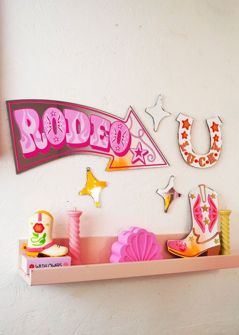 Get ready to add some western flair to your home with our Rodeo Arrow Mirror! Its bold, retro design in the shape of a rodeo sign arrow will bring a touch of circus style to any room. Perfect for those who don't take themselves too seriously. (Yee-haw!) Comes with COMMAND strips for hanging UV printed vinyl & acrylic mirror Size: 43cm x 20cm Disco Nursery, Vinyl Acrylic, Retro Mirror, Wavy Mirror, Big Mirror, Mirror House, Yee Haw, Retro Wall Decor, Mirror Shop