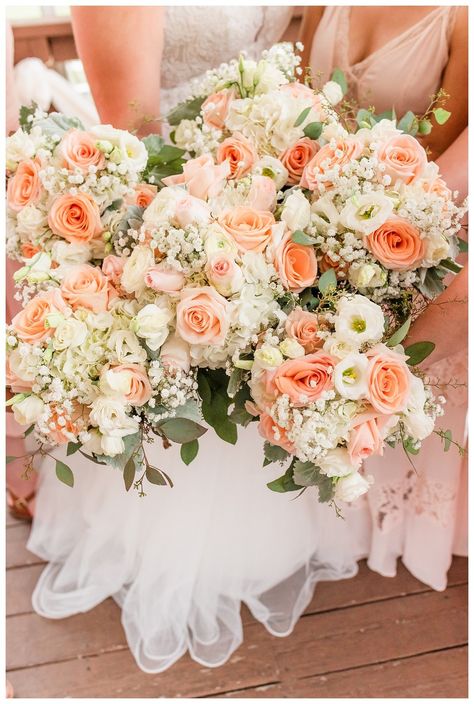 Peach and white wedding flowers #peach #whiteroses #peachwedding Coral Peach And Gold Wedding, Coral Pink White Wedding Flowers, Peach And Ivory Bouquet, Peach And White Floral Arrangements, White Peach Coral Wedding Flowers, Peach And White Bridesmaid Bouquet, Wedding Flowers Peach And White, Peach Pink And Sage Wedding, Peach Colored Wedding Theme