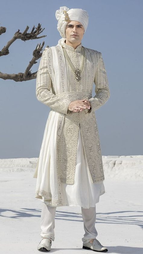 Introducing a white sherwani with thread embroidery work that is layered with a matching plain anarkali kurta and a beautifully designed waist belt. Paired with a white color dupatta and a matching churidar. Shop White Wedding Sherwani For Groom Online at Tathastu. Shipping Worldwide. Anarkali Sherwani Men, Shervani Design For Men, Wedding Dress For Groom, Plain Anarkali, Wedding Sherwani For Groom, Groom Indian Wedding Outfits, White Sherwani, Sherwani For Groom, Indian Groom Dress