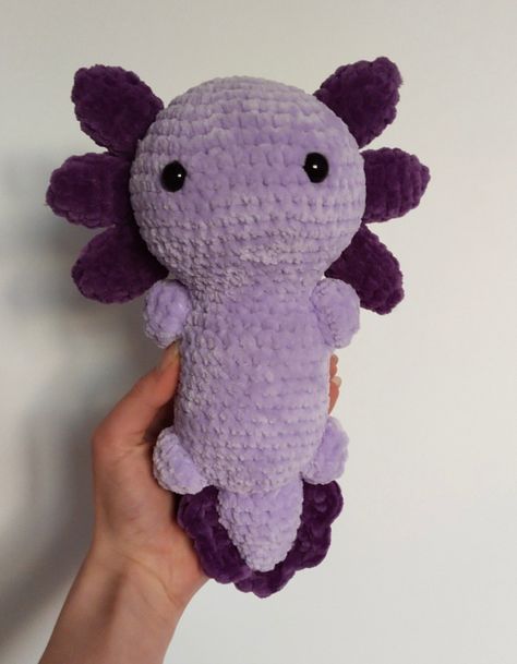 Crochet purple axolotl plushie handmade How To Make A Crochet Axolotl, Crochet Purple Animal, Cute Crochet Axolotl, How To Crochet A Axolotl, Crochet Purple Plushie, Purple Crochet Animals, Purple Crochet Patterns, Cute Plushies To Crochet, Purple Crochet Plushies