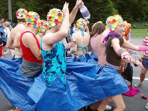 Easy group costume. Buy retro petal swim caps from www.headcovers.com. Add a blue tarp from Home Depot and one piece swim suit or tank top. Great for fun runs, Halloween, etc. Team Halloween Costumes, Camp Dress, Quick Costumes, Team Costumes, Olympic Swimming, Youth Camp, Synchronized Swimming, Running Costumes, Women Costumes