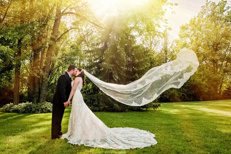 A long wedding dress veil flies in the air as the bride kisses her groom. Flying Veil Wedding Photos, Long Veil Wedding Photos, Indoor Church Wedding, Long Distance Wedding, Winter Mountain Wedding, Wedding Dress Veil, Concept Shoot, Valparaiso Indiana, Wedding Shot List