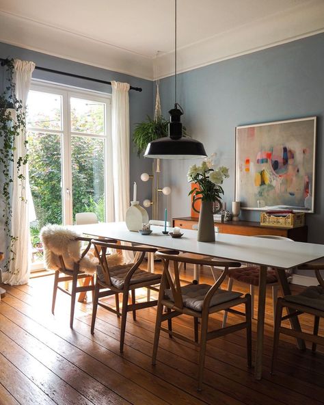 Combining soft muted blue walls with white ceilings in your dining room creates a serene and elegant atmosphere. This color combination is versatile and can easily be complemented with various furniture styles and accessories. You can add a touch of warmth with wooden accents and pops of color through artwork will further enhance the overall aesthetic of the dining room. Soft muted blue from @heyheyhaus French Blue Dining Room Walls, Blue Living And Dining Room Ideas, Blue Grey Dining Room Walls, Dining Room Light Blue Walls, Pale Blue Dining Room, Blue Grey Dining Room, Slate Blue Dining Room, Gray Blue Dining Room, Light Blue Dining Room