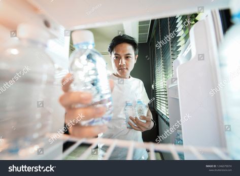 Asian man storing plastic bottles of drinking water in refrigerator, view from inside of refrigerator, wide angle pers #Ad , #Ad, #plastic#bottles#drinking#Asian Inside Refrigerator, Commercial Illustration, Manufactured Homes For Sale, Kitchen Colour, Pocari Sweat, Bottle Drawing, Drawing Architecture, Perspective Drawing Architecture, Inside Car