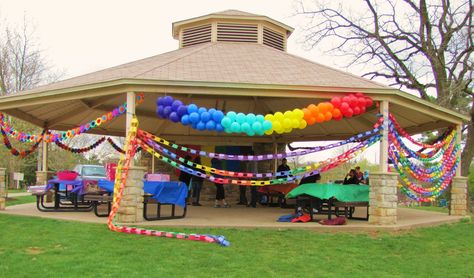 Rainbow balloon arch & many yards of rainbow paper chains. Super cheap & big impact for a rainbow party :-) Rainbow Outdoor Party, Birthday Gazebo Decorations, How To Decorate A Pavilion For A Party, Park Decoration Ideas Birthday, Gazebo Party Decorations, Pavilion Decorating Ideas Party, Park Ramada Birthday Decorations, Rainbow Party Decorations Outdoor, Gazebo Birthday Decorations