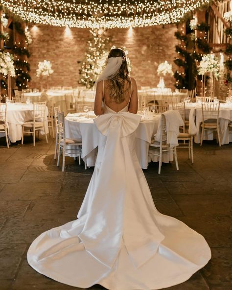 Wedding Dress With Bow And Veil, Whimsical Classic Wedding Dress, Wedding Dresses With A Bow In The Back, Silk Bow Wedding Dress, Long Sleeve Wedding Dress With Bow, Giant Bow Wedding Dress, Wedding Bow Dress, Silk Wedding Dress With Bow, Wedding Dresses Bow On Back