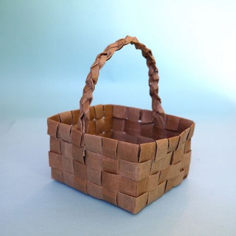 How to Make Baskets From Paper Grocery Bags | eHow Boho Basket Decor, Paper Basket Weaving, Paper Bag Flooring, Diy Paper Bag, Paper Bag Album, Paper Grocery Bags, Paper Bag Crafts, Paper Lunch Bags, Paper Bag Puppets