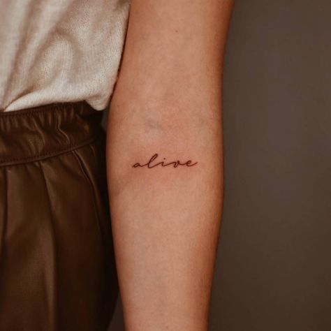 Script Name Tattoo Forearm, Alive Tattoo Ideas, Name Tattoos Placement, Name On Forearm Tattoo, Cursive Arm Tattoo, Forearm Name Tattoo, Script Name Tattoo, Forearm Word Tattoo, Name Tattoo Placements