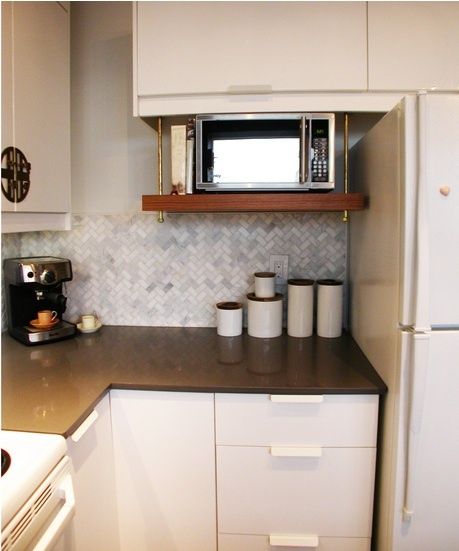 I LOVE the way this microwave is mounted! I don't know how this will work for my microwave because I think it is 15-18" deep. Microwave Cabinet, Microwave Shelf, Microwave In Kitchen, Eclectic Kitchen, White Cabinetry, Tiny Kitchen, Updated Kitchen, White Cabinets, Kitchen Shelves