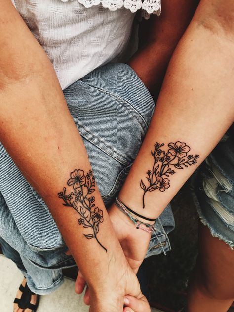 My mother/ daughter tattoo #flowertattoo #motherdaughter #flowers Mother Daughter Tattoos Country, Edgy Mother Daughter Tattoos, Mother And Multiple Daughter Tattoos, Mother Daughter Tattoos Floral, Mother Daughter Tattoos Meaningful For 3, Small Matching Tattoos Mom And Daughter Flower, Unique Mother Daughter Tattoos Matching, Dainty Matching Tattoos Mother Daughter, Mother Daughter Tattoos Western