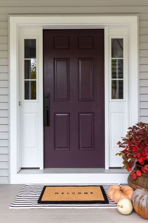 When we bought our new build house back in 2017, there were a lot of paint color decisions to make all at once, and I wasn’t really prepared to make them.When asked what color I wanted for the front door, I was like, “Um, black, I guess?”Because you can never go wrong with black!But over the years, I started feeling like I was missing a big style opportunity. Sure, the black was classic and elegant, but you want your front door to make a statement, you know?So, now that my front door i… Purple Garage Door, Dark Plum Front Door, Grey House Purple Door, Purple Front Door Paint Colors, Deep Purple Front Door, Eggplant Front Door Color, Purple Doors Front House, Plum Front Door, Purple Front Door Colors