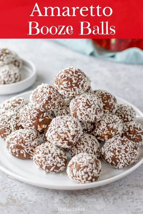 Oct 12, 2020 - These amazing Amaretto booze balls are so easy to make and so good that you need to hide them from the children.  They will be the star of the show when you bring them to parties. Liquor Balls, Amaretto Balls, Booze Balls, Alcohol Desserts, Dessert Balls, Boozy Baking, Kahlua Recipes, Xmas Recipes, Alcoholic Desserts