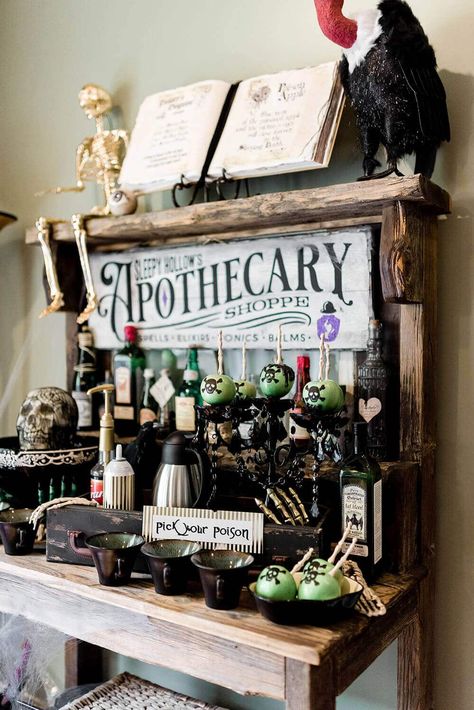 Witch Table Decorations Halloween Party, Halloween Apothecary Decor Ideas, Potions Halloween Decor, Spooky Apothecary Display, Apothecary Halloween Party, Halloween Potion Bottles Display, Potions Bar Halloween, Apothecary Table Decor, Poison Apple Halloween Decor